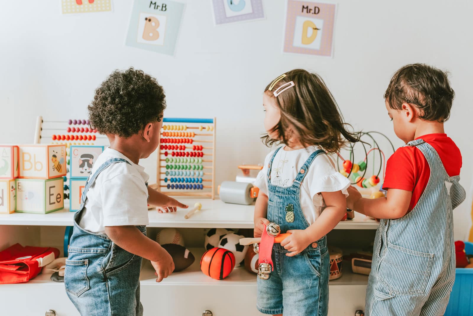 Young children playing with educational toys